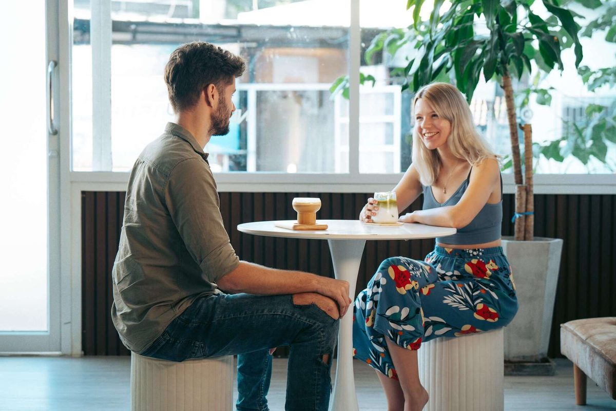 Two members chatting over coffee
